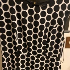 Black and white polka dot dress. Hits above knee.